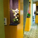 {PRACTICE_NAME} hallway with decorative flowers